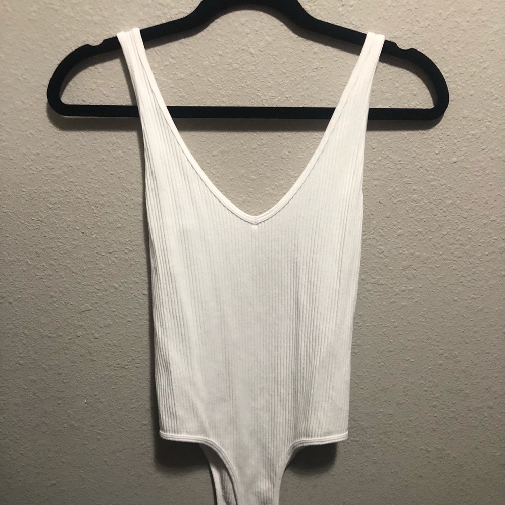 White no sleeve Bodysuit one size.